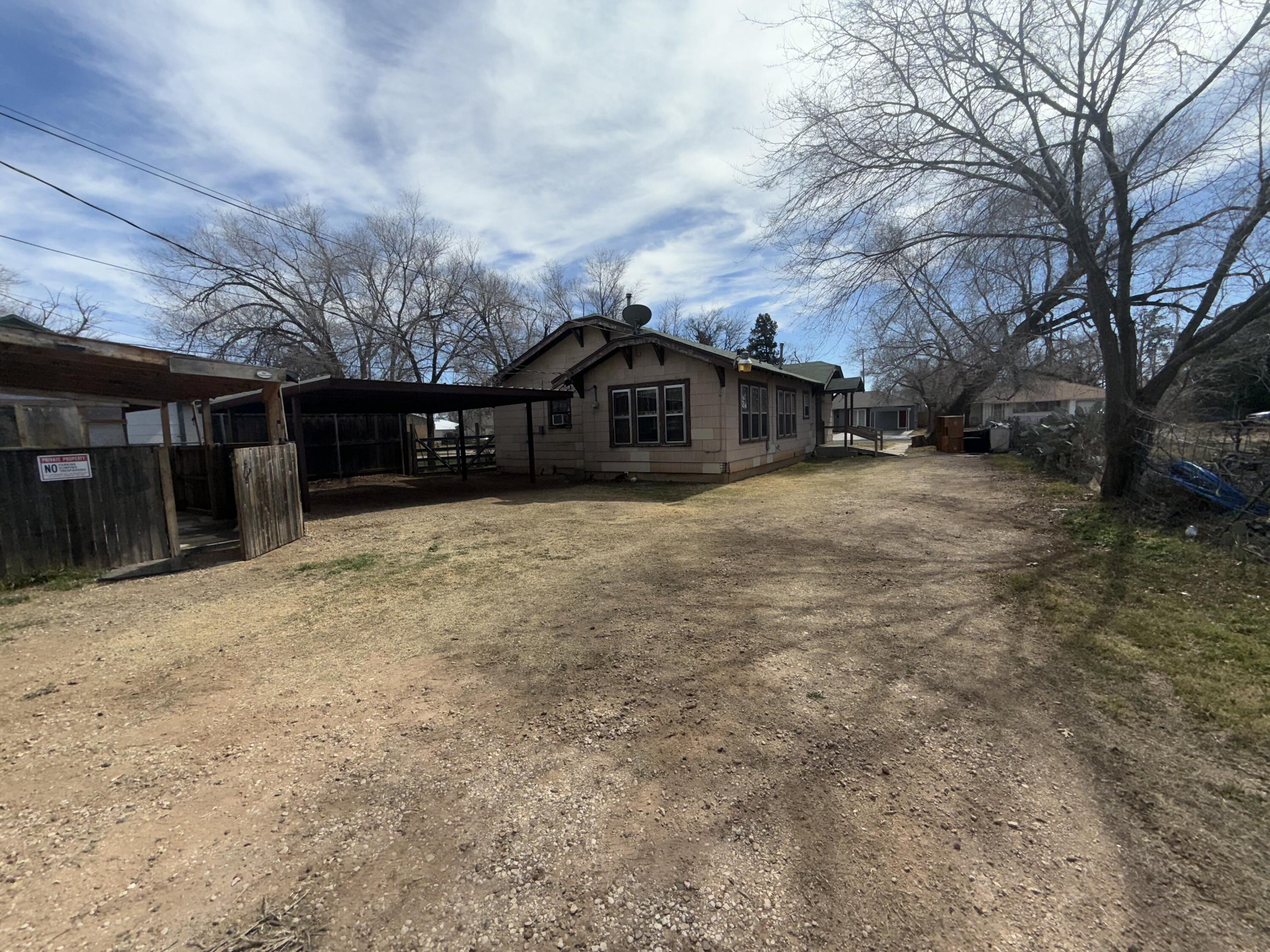Package Package Property Lubbock, TX 79411 - Photo 49 of 107 a front view of a house with a yard
