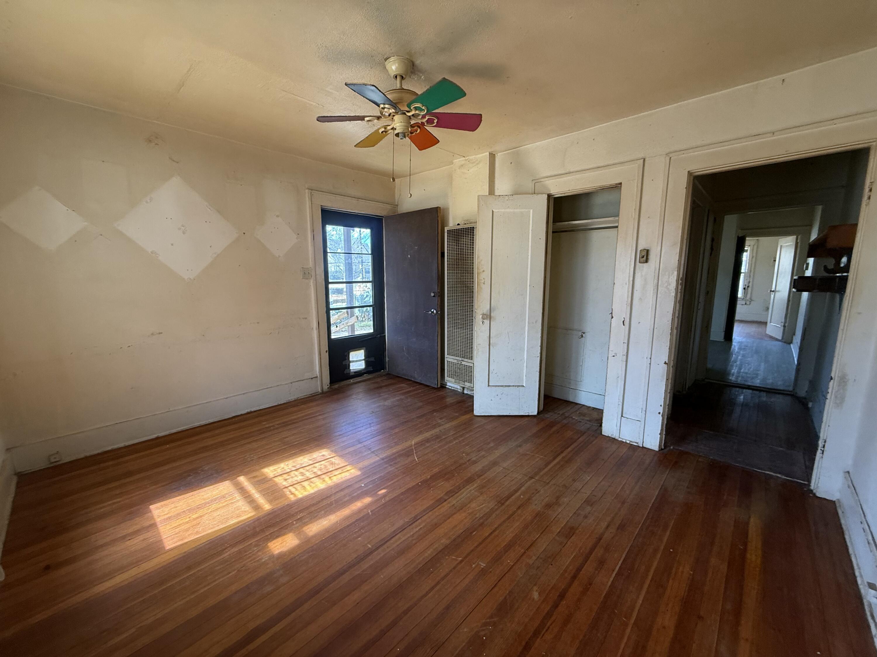 Package Package Property Lubbock, TX 79411 - Photo 63 of 107 a view of empty room with wooden floor and fan