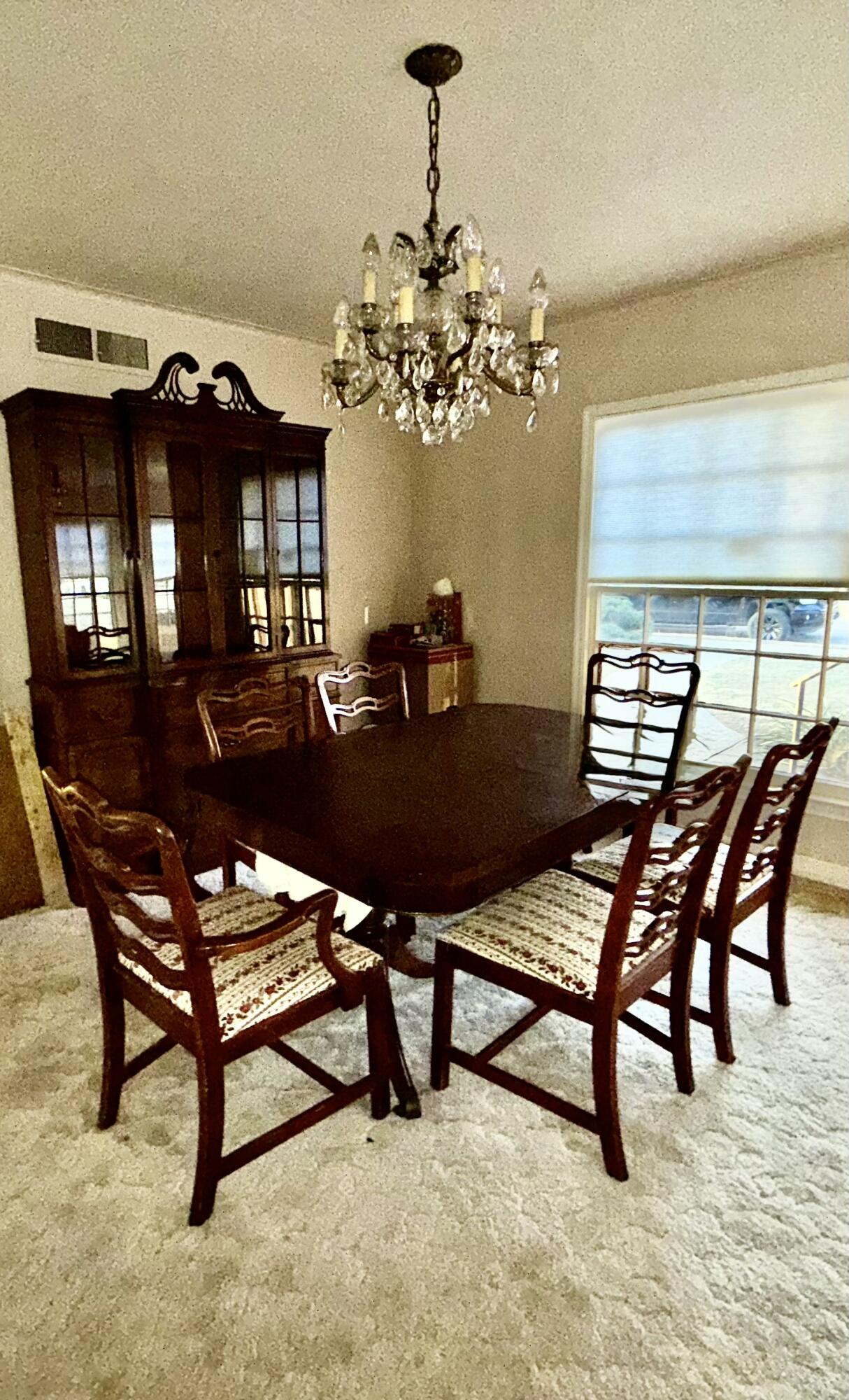 Package Package Property Lubbock, TX 79411 - Photo 79 of 107 a view of a dining room with furniture and a chandelier