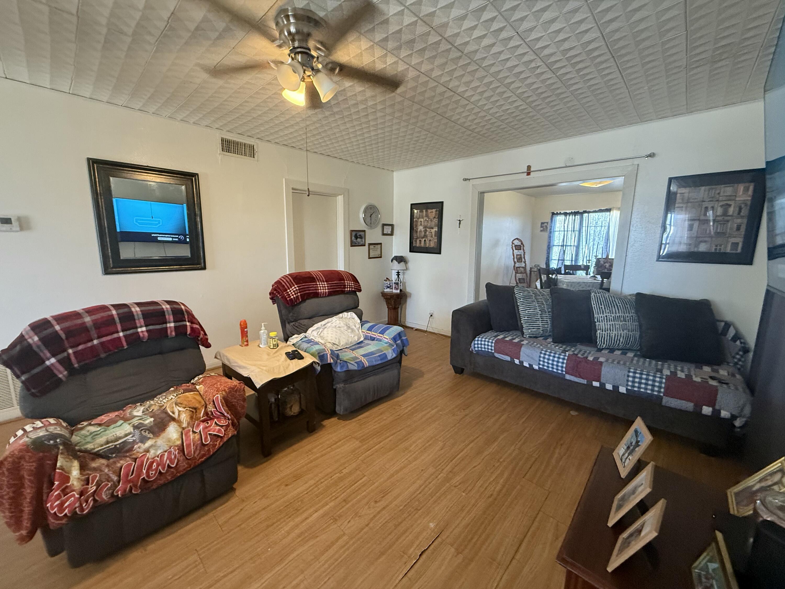 Package Package Property Lubbock, TX 79411 - Photo 8 of 107 a living room with furniture and a couch