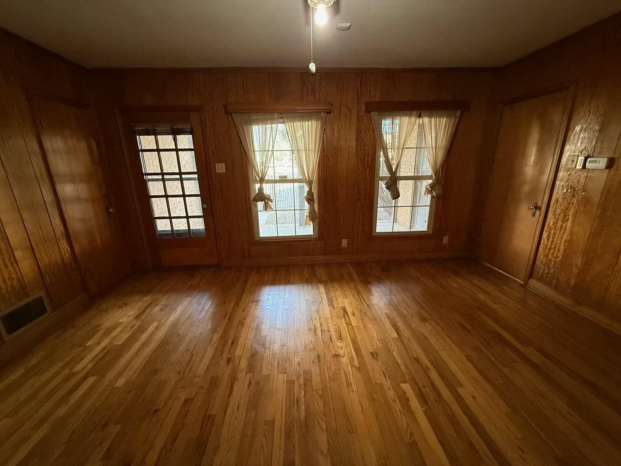 Package Package Property Lubbock, TX 79411 - Photo 97 of 107 wooden floor in an empty room with a window