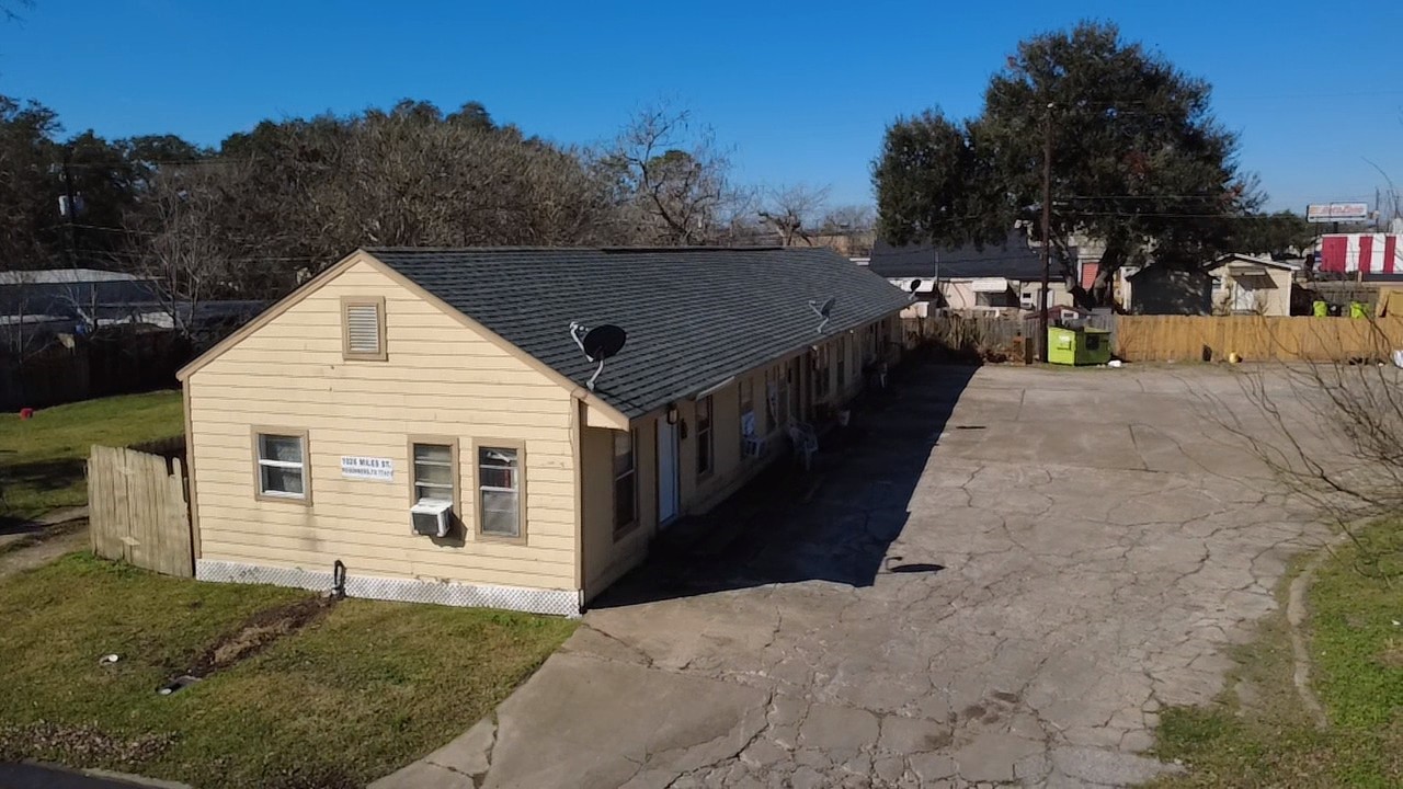 1026 Miles Street Rosenberg, TX 77471 - Photo 3 of 11 a view of house along the path and trees
