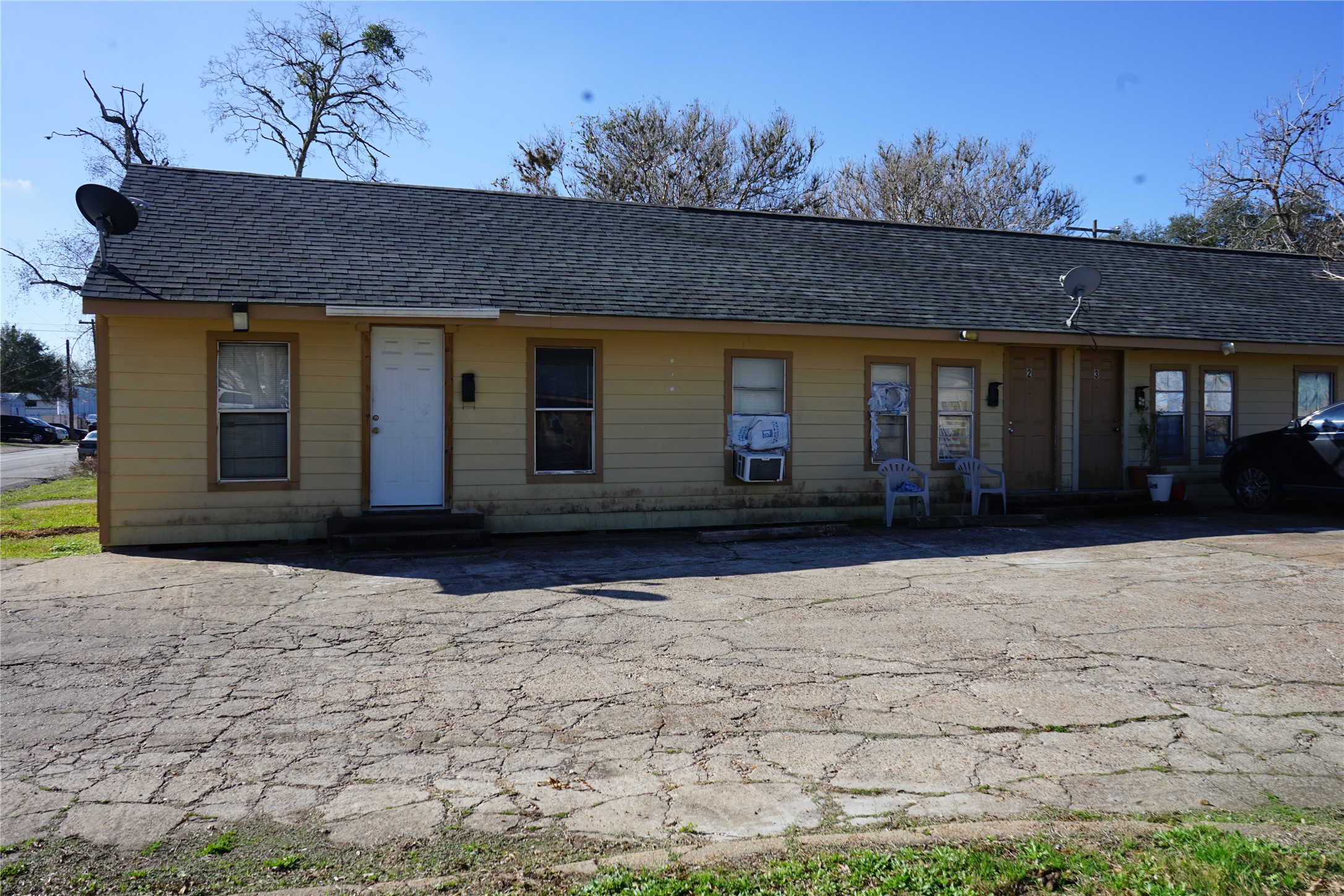 1026 Miles Street Rosenberg, TX 77471 - Photo 4 of 11 a view of house with backyard and trees in the background