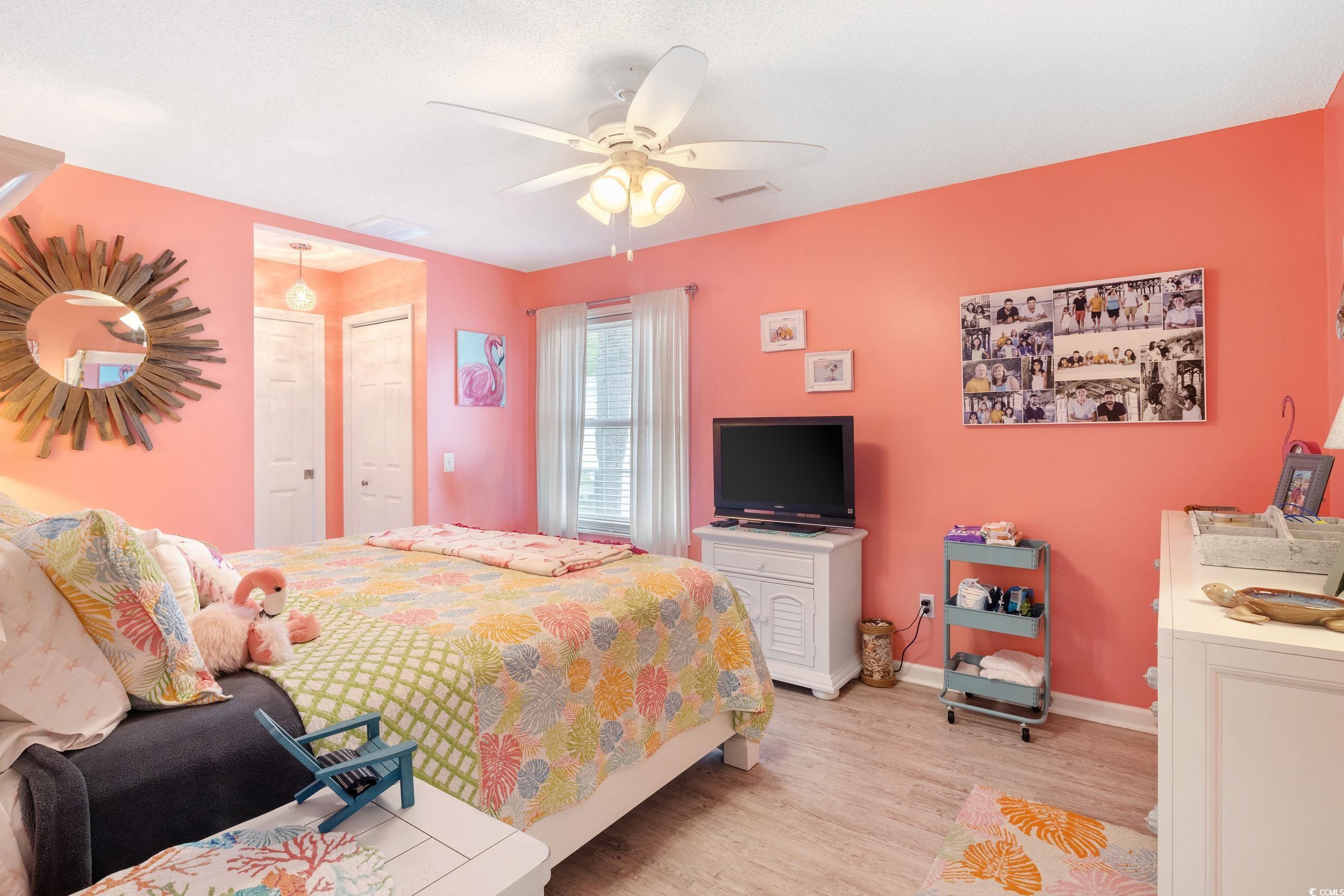 919 Dock Place Murrells Inlet, SC 29576 - Photo 16 of 39 Bedroom featuring light wood-style flooring and ceiling fan