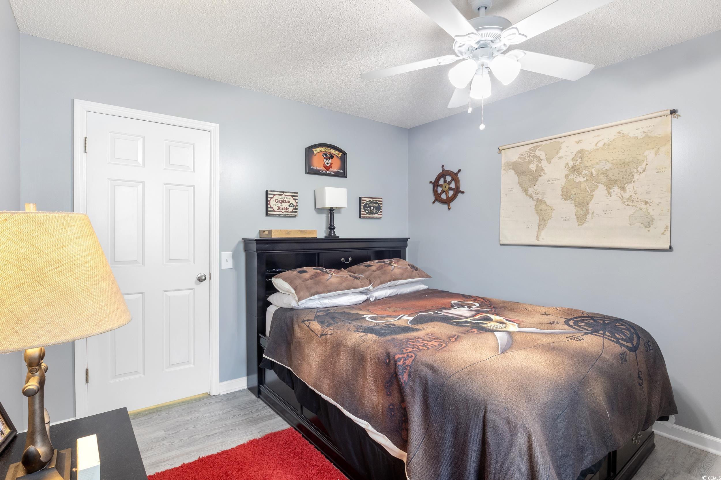 919 Dock Place Murrells Inlet, SC 29576 - Photo 21 of 39 Bedroom with wood finished floors and a ceiling fan