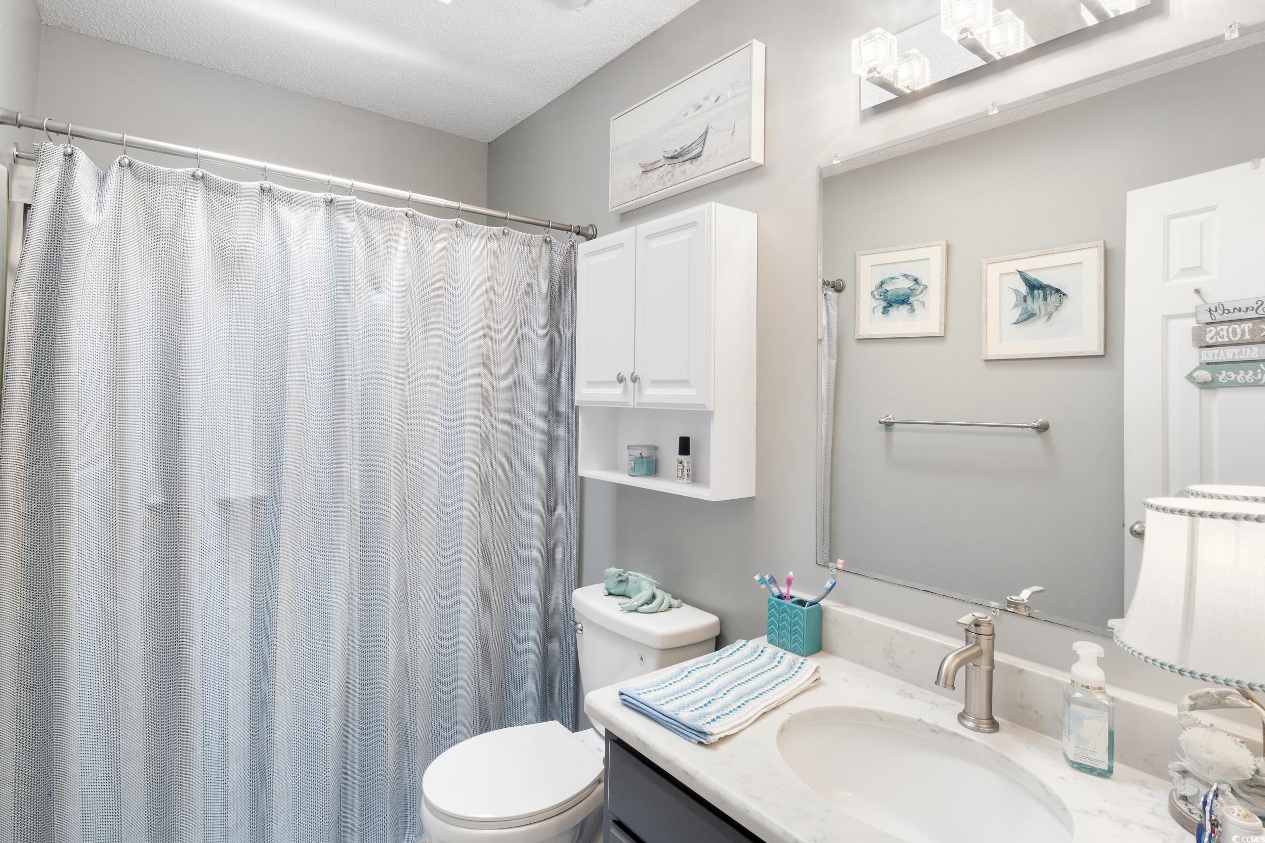 919 Dock Place Murrells Inlet, SC 29576 - Photo 24 of 39 Bathroom with vanity and a shower with curtain