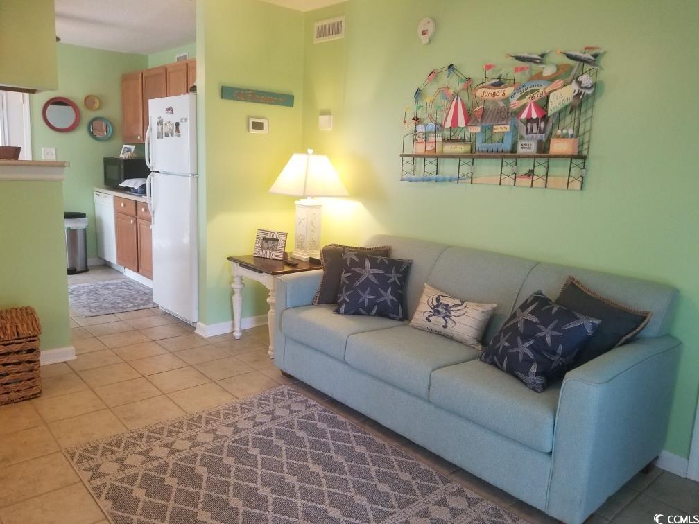 919 Dock Place Murrells Inlet, SC 29576 - Photo 37 of 39 Living room featuring light tile patterned flooring and baseboards