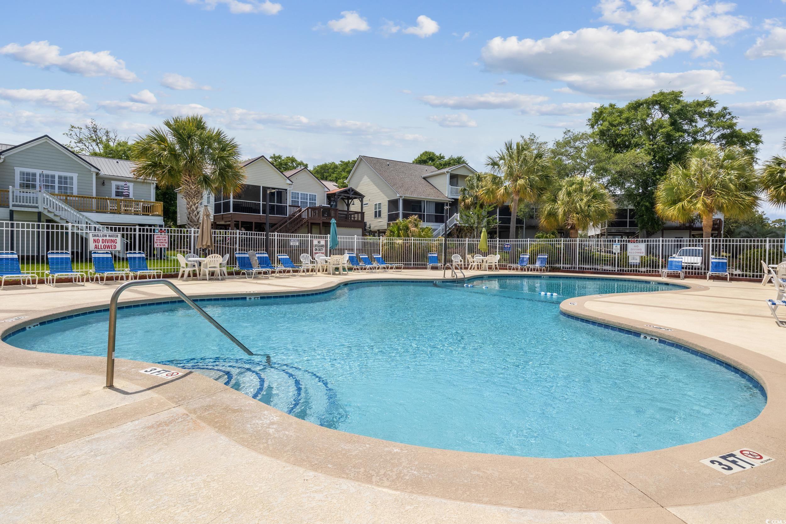 919 Dock Place Murrells Inlet, SC 29576 - Photo 38 of 39 Community pool with a patio and a residential view