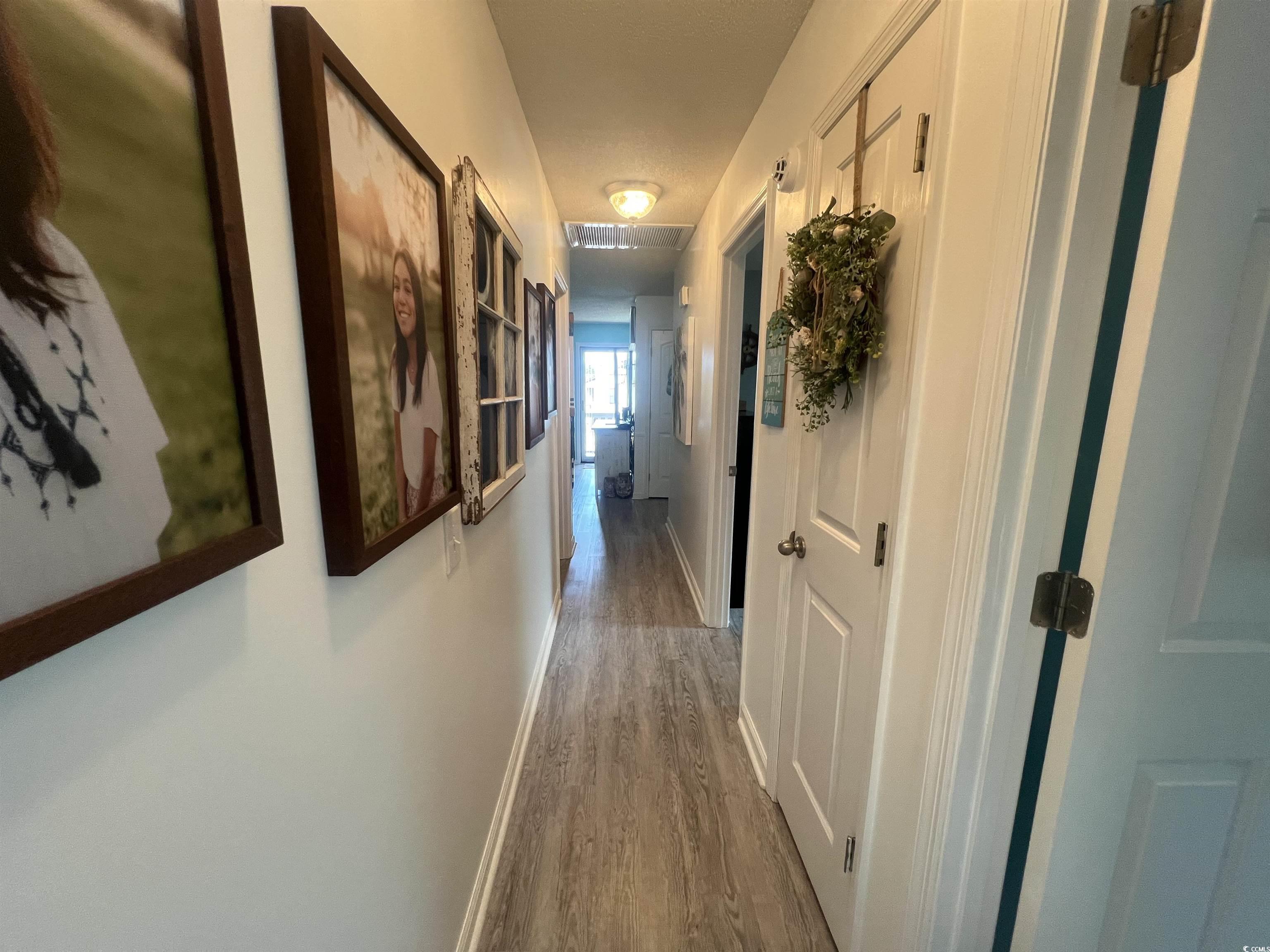 919 Dock Place Murrells Inlet, SC 29576 - Photo 4 of 39 Hall featuring wood finished floors and baseboards