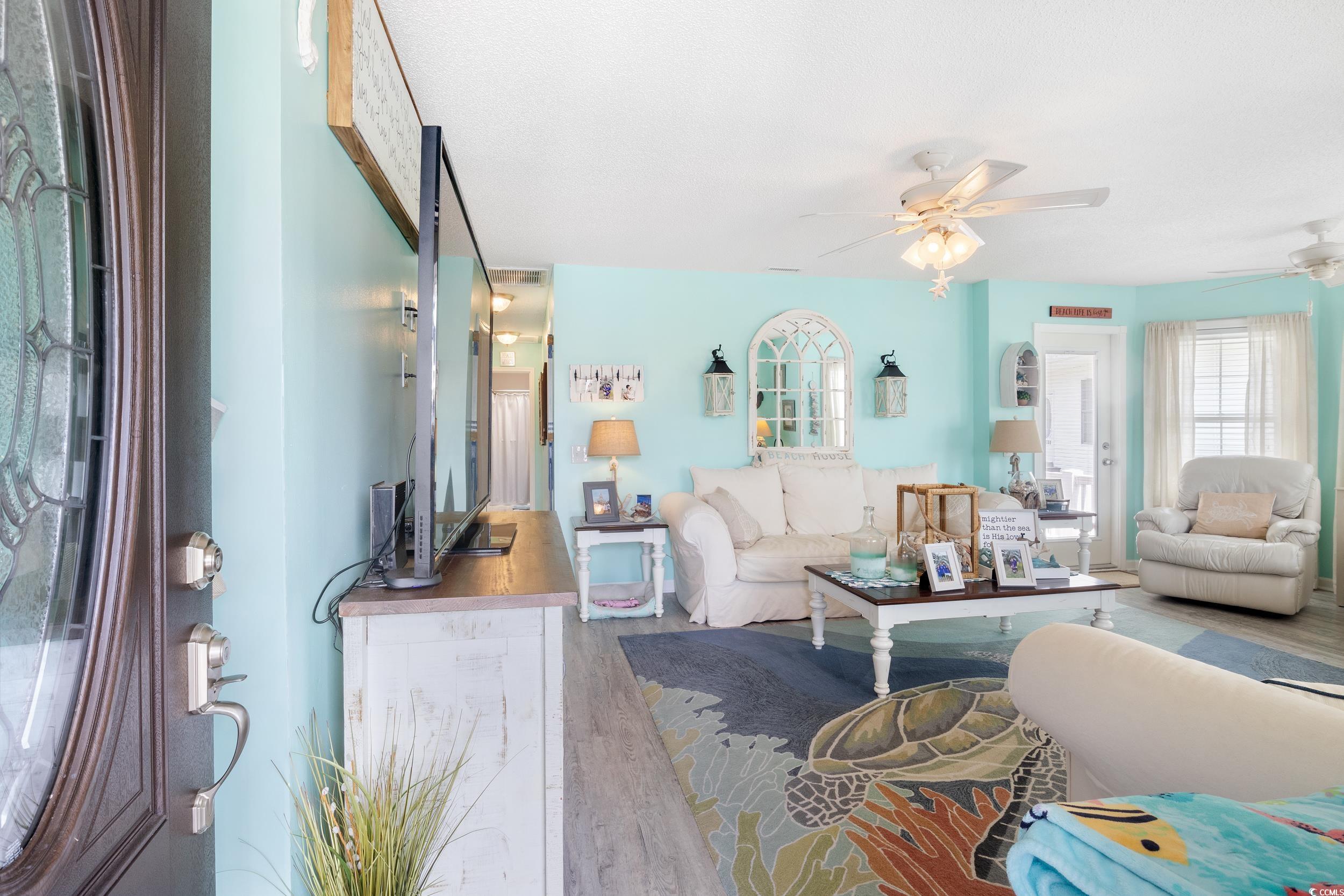 919 Dock Place Murrells Inlet, SC 29576 - Photo 5 of 39 Living room featuring ceiling fan and wood finished floors