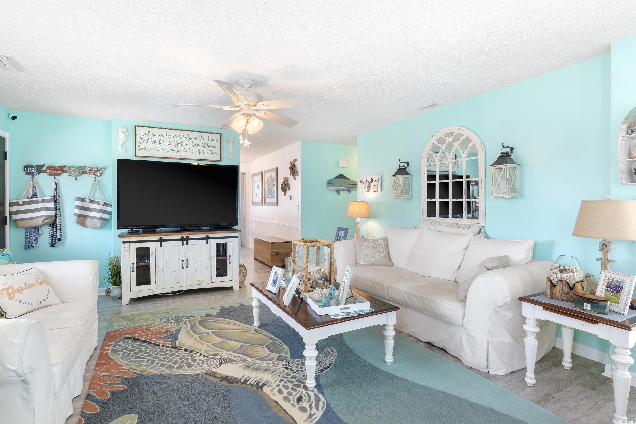 919 Dock Place Murrells Inlet, SC 29576 - Photo 7 of 39 Living area featuring wood finished floors and ceiling fan