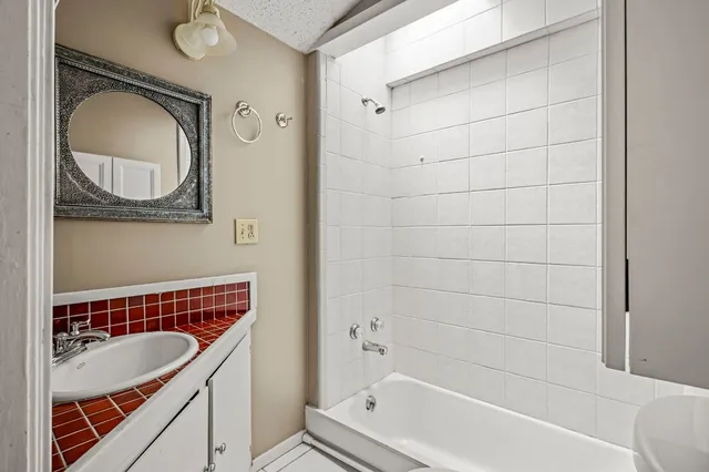 a bathroom with a sink and a bathtub