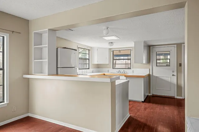 a view of kitchen with wooden floor