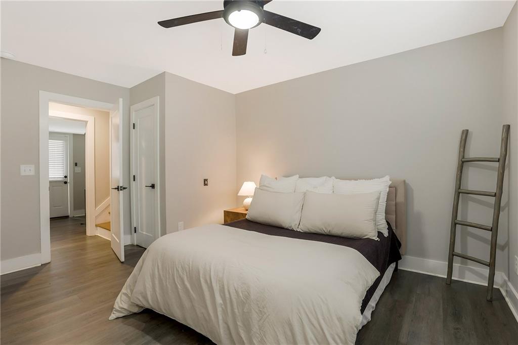 1344 Midlawn Drive Decatur, GA 30032 - Photo 30 of 87 a bedroom with a bed and a chandelier