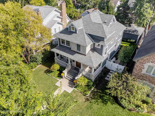 an aerial view of a house with a garden
