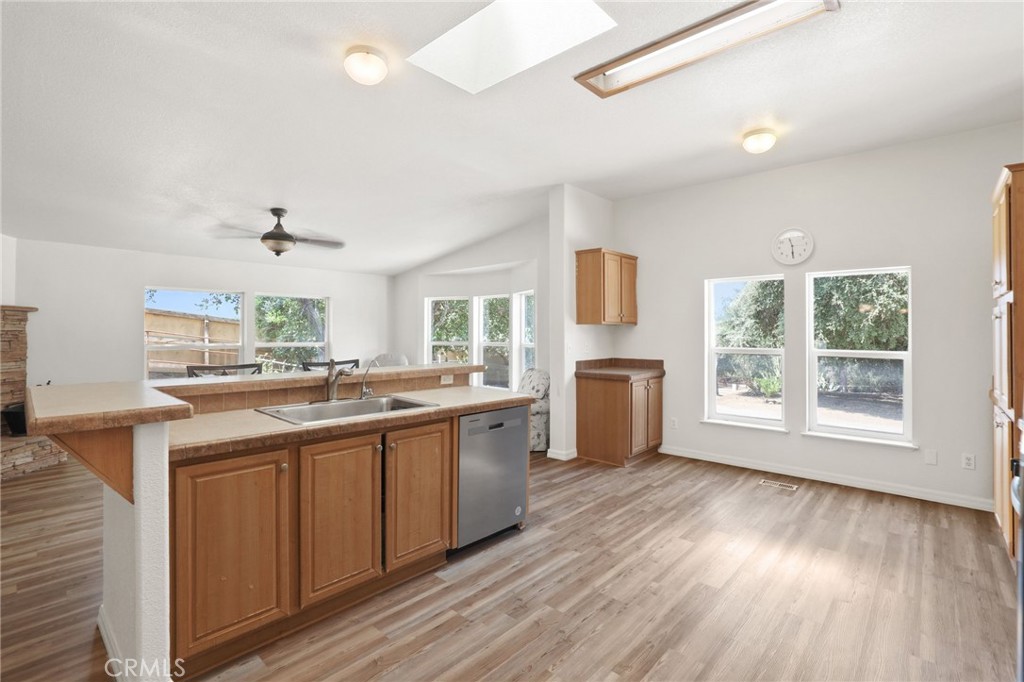 10880 Fox Springs Road Fallbrook, CA 92028 - Photo 17 of 39 a kitchen with lots of counter top space and wooden floor