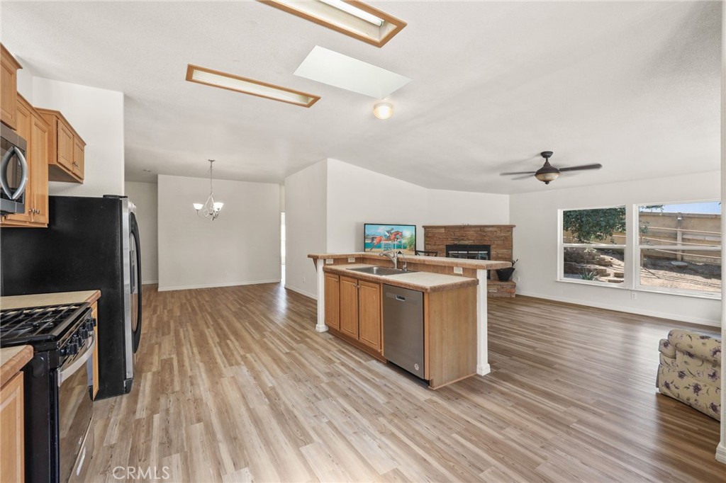 10880 Fox Springs Road Fallbrook, CA 92028 - Photo 18 of 39 a kitchen with a sink and a stove top oven