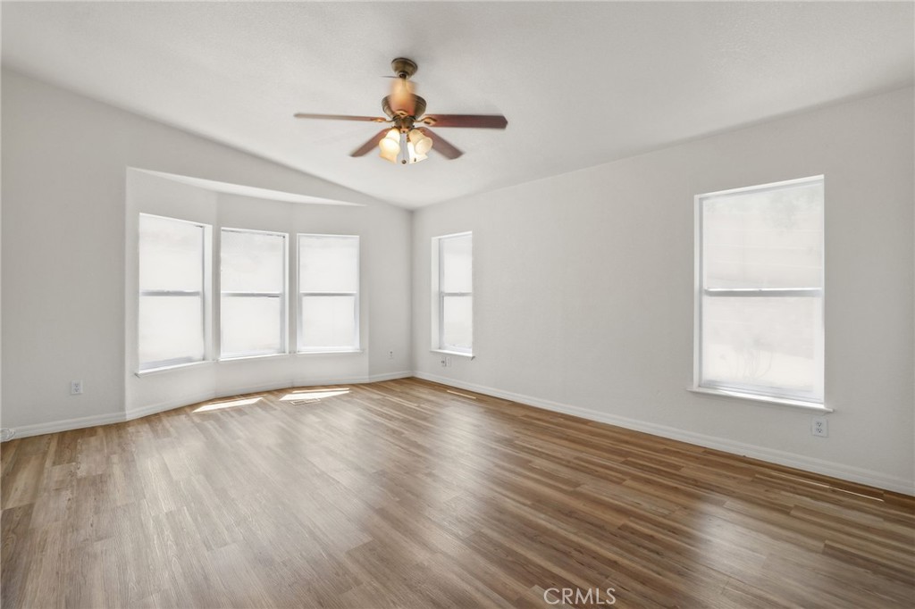 10880 Fox Springs Road Fallbrook, CA 92028 - Photo 24 of 39 a view of an empty room with wooden floor and a window