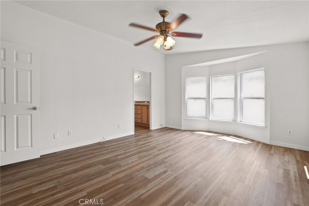 10880 Fox Springs Road Fallbrook, CA 92028 - Photo 25 of 39 a view of an empty room with wooden floor and a window