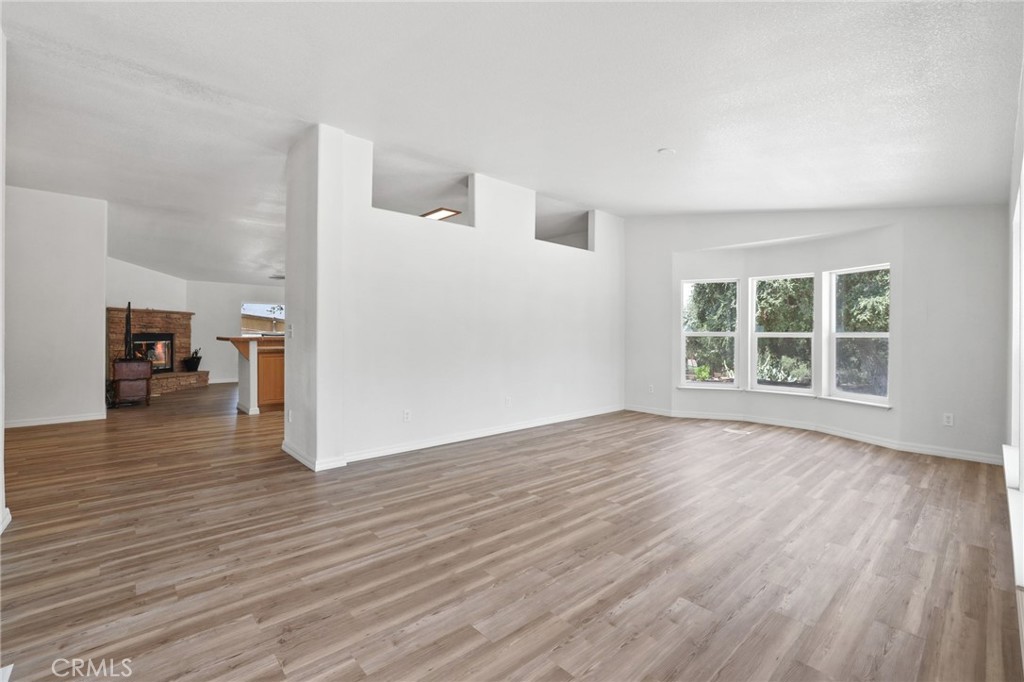 10880 Fox Springs Road Fallbrook, CA 92028 - Photo 7 of 39 wooden floor in an empty room with a window
