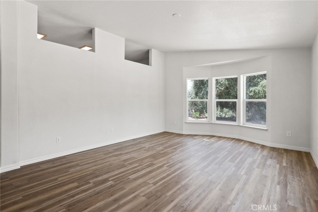 10880 Fox Springs Road Fallbrook, CA 92028 - Photo 8 of 39 wooden floor in an empty room with a window