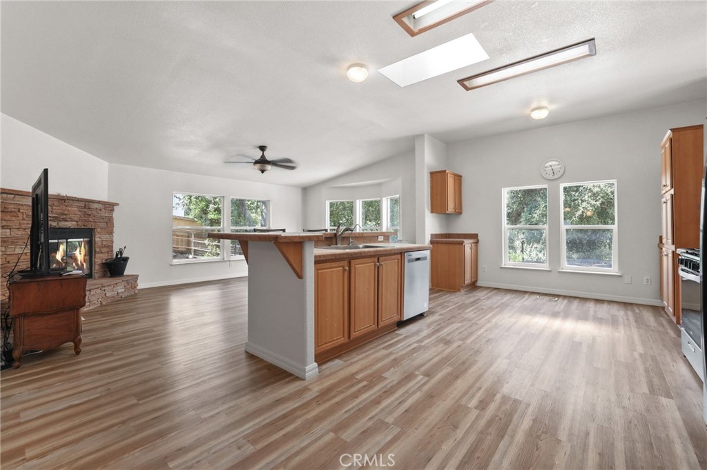10880 Fox Springs Road Fallbrook, CA 92028 - Photo 10 of 39 a kitchen with kitchen island wooden floors and stainless steel appliances