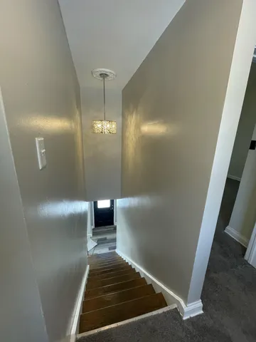 a bathroom with a sink shower and a mirror