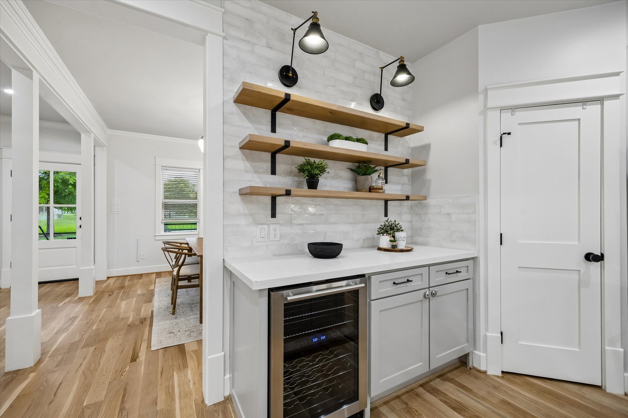 910 Northwood Street Houston, TX 77009 - Photo 10 of 28 a kitchen with a stove and wooden floor