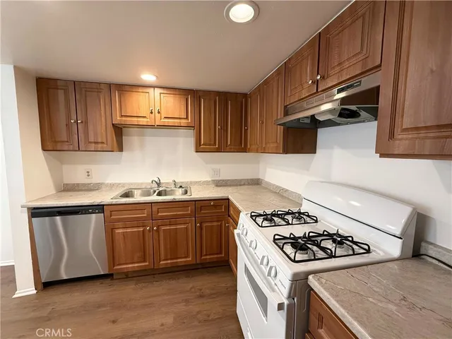 a kitchen with a stove and a sink