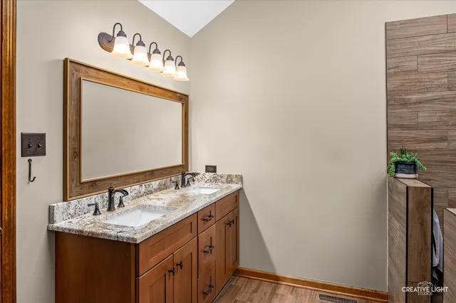 a bathroom with a sink and a mirror