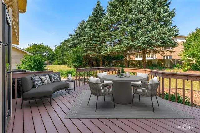 a view of balcony with wooden floor and fence