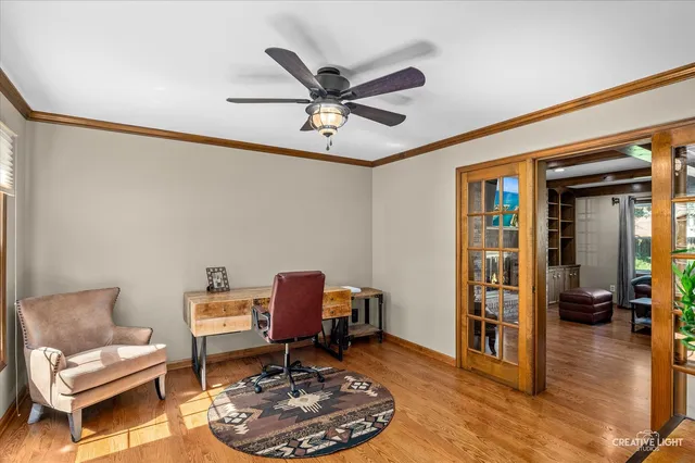 a work room with furniture and wooden floor