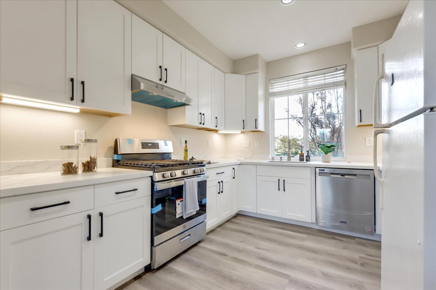 2276 Towne Circle Mountain View, CA 94040 - Photo 11 of 37 a kitchen with stainless steel appliances white cabinets and a sink
