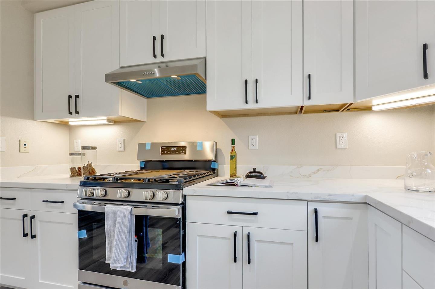 2276 Towne Circle Mountain View, CA 94040 - Photo 12 of 37 a kitchen with stainless steel appliances granite countertop a sink a stove and cabinets