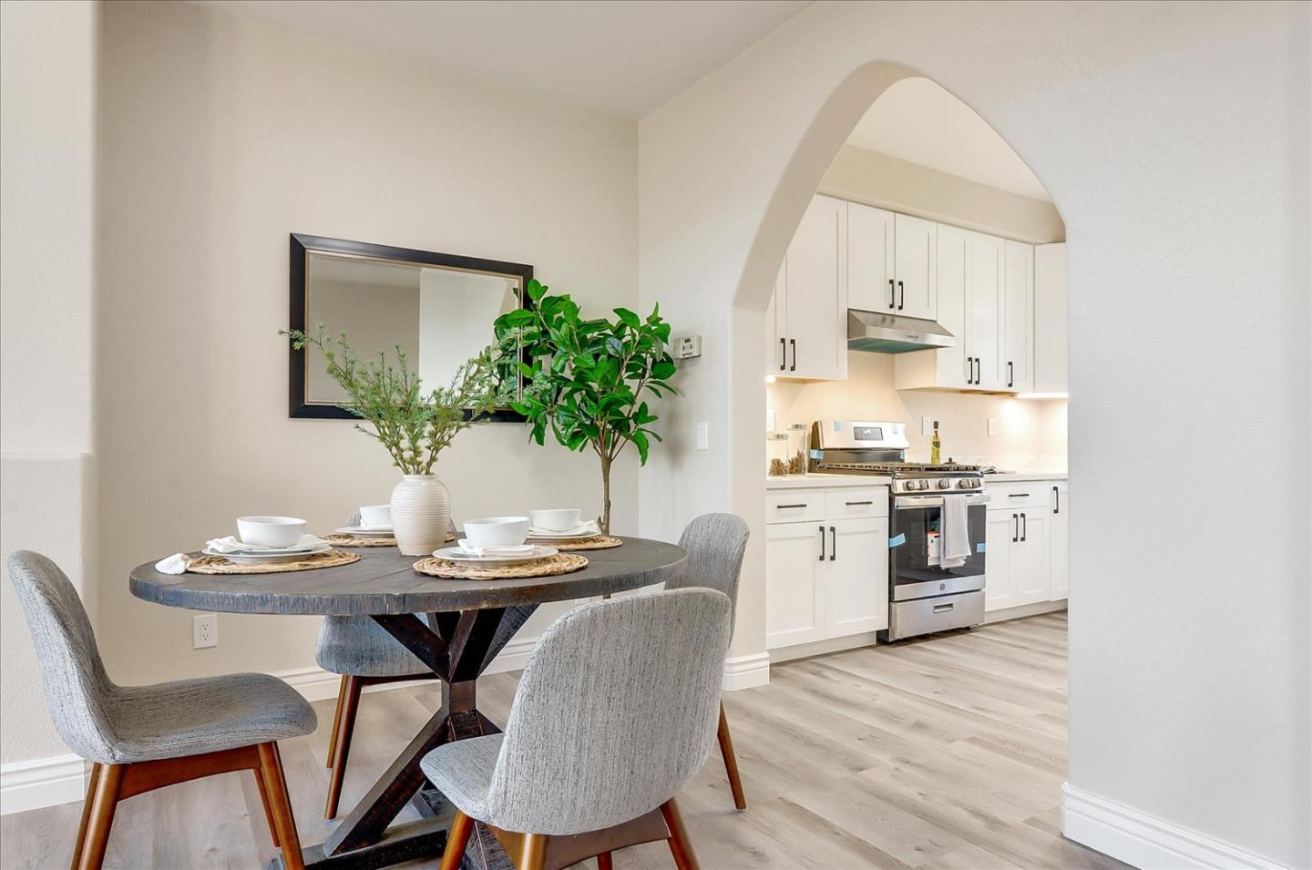 2276 Towne Circle Mountain View, CA 94040 - Photo 15 of 37 a kitchen with stainless steel appliances kitchen island a table and chairs in it