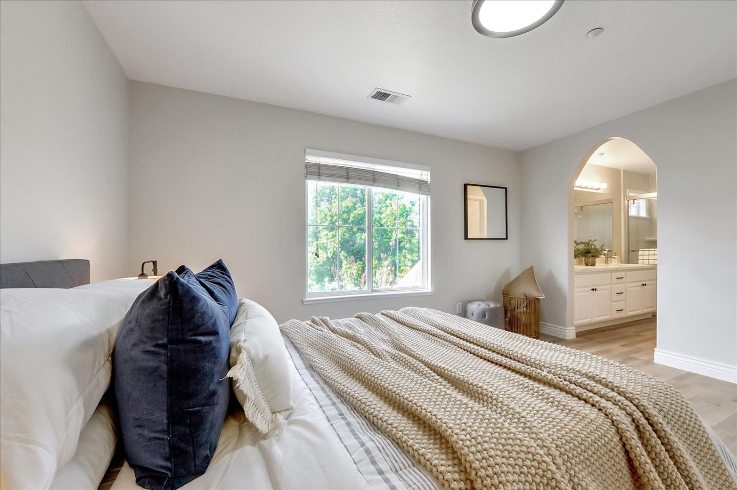 2276 Towne Circle Mountain View, CA 94040 - Photo 19 of 37 a bedroom with a bed and a large window