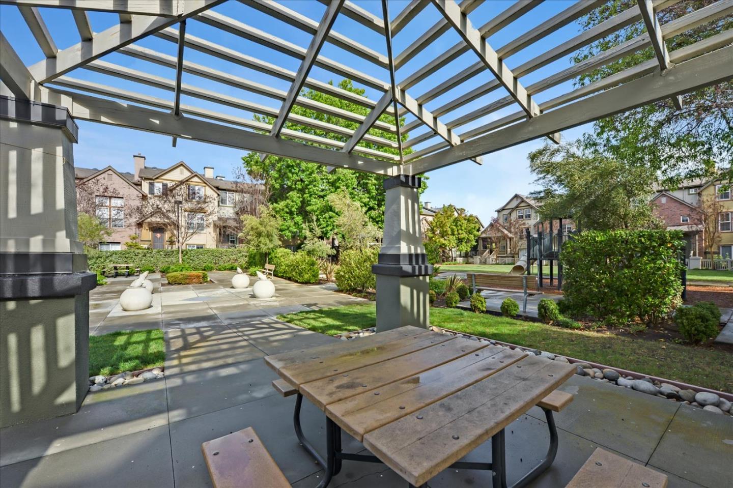 2276 Towne Circle Mountain View, CA 94040 - Photo 35 of 37 a view of a wooden table and chairs in patio