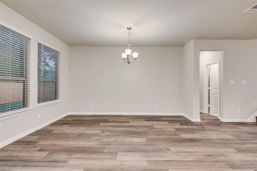 739 Copley Street Sherman, TX 75090 - Photo 14 of 31 a view of a livingroom with wooden floor and a window