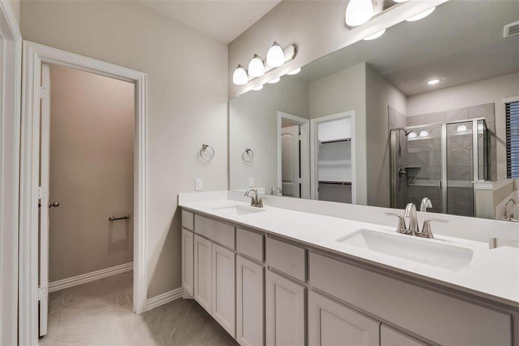 739 Copley Street Sherman, TX 75090 - Photo 21 of 31 a bathroom with a sink double vanity and a mirror