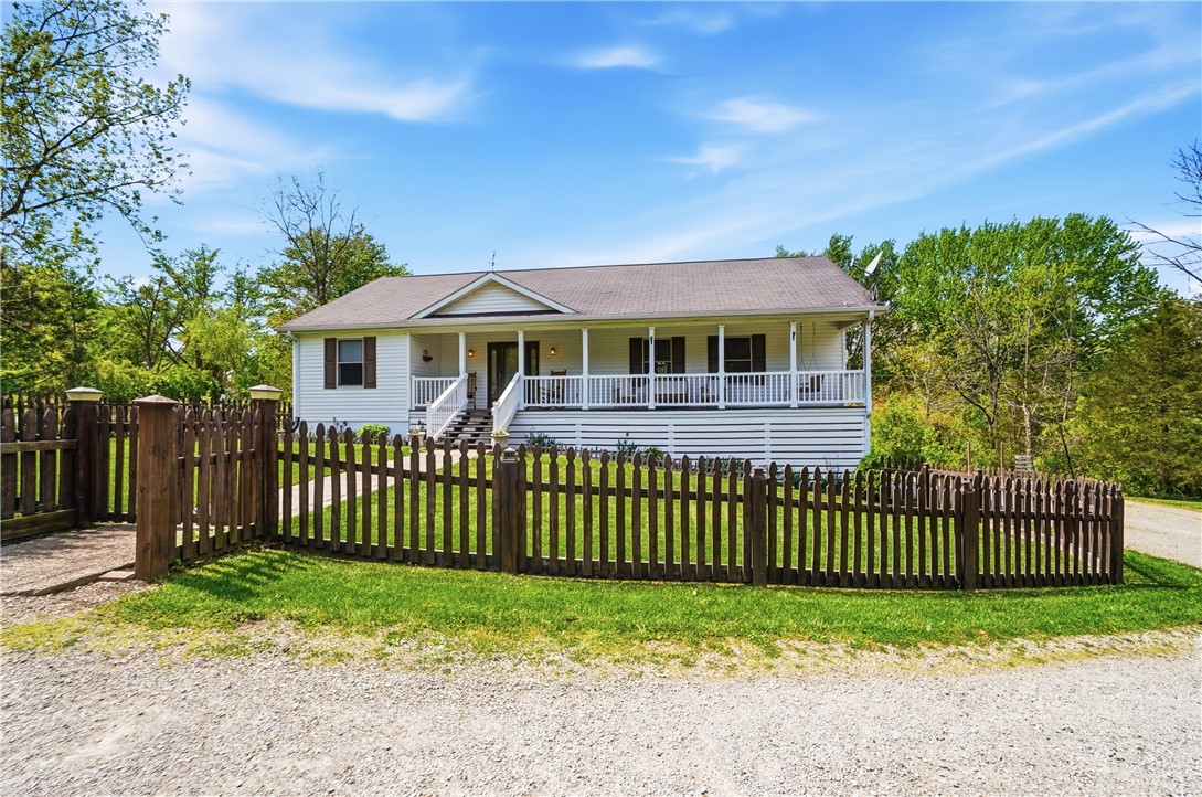 1208 Jarva Lane Springboro, OH 45066 - Photo 6 of 75 This charming home features a welcoming porch, a spacious yard, and a picket fence.