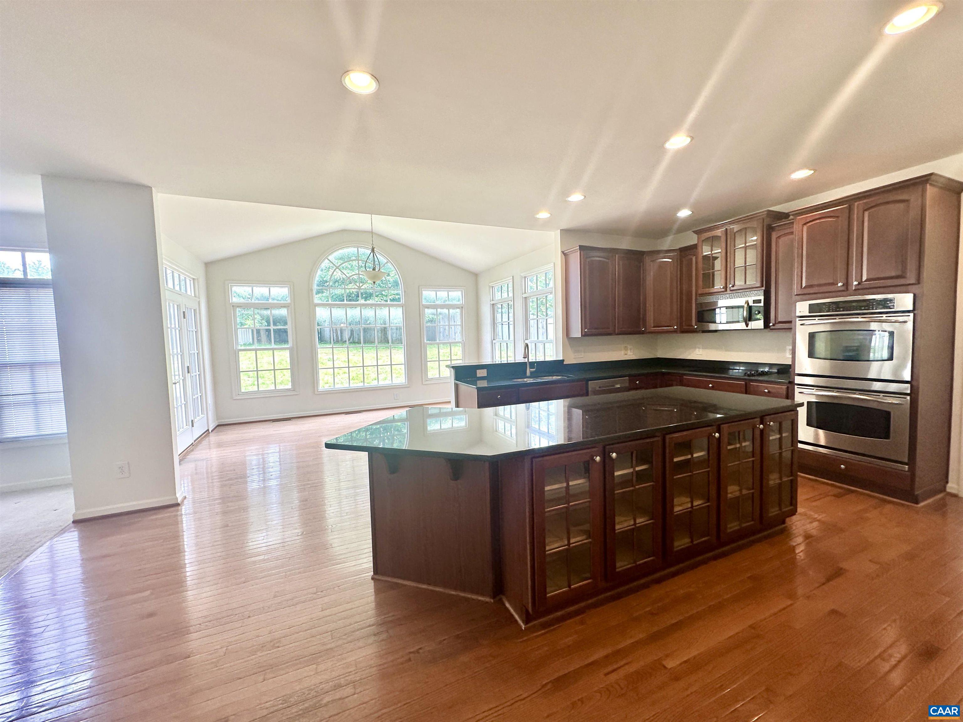 252 Millstream Drive Crozet, VA 22932 - Photo 3 of 41 a large kitchen with stainless steel appliances granite countertop a stove and a large window