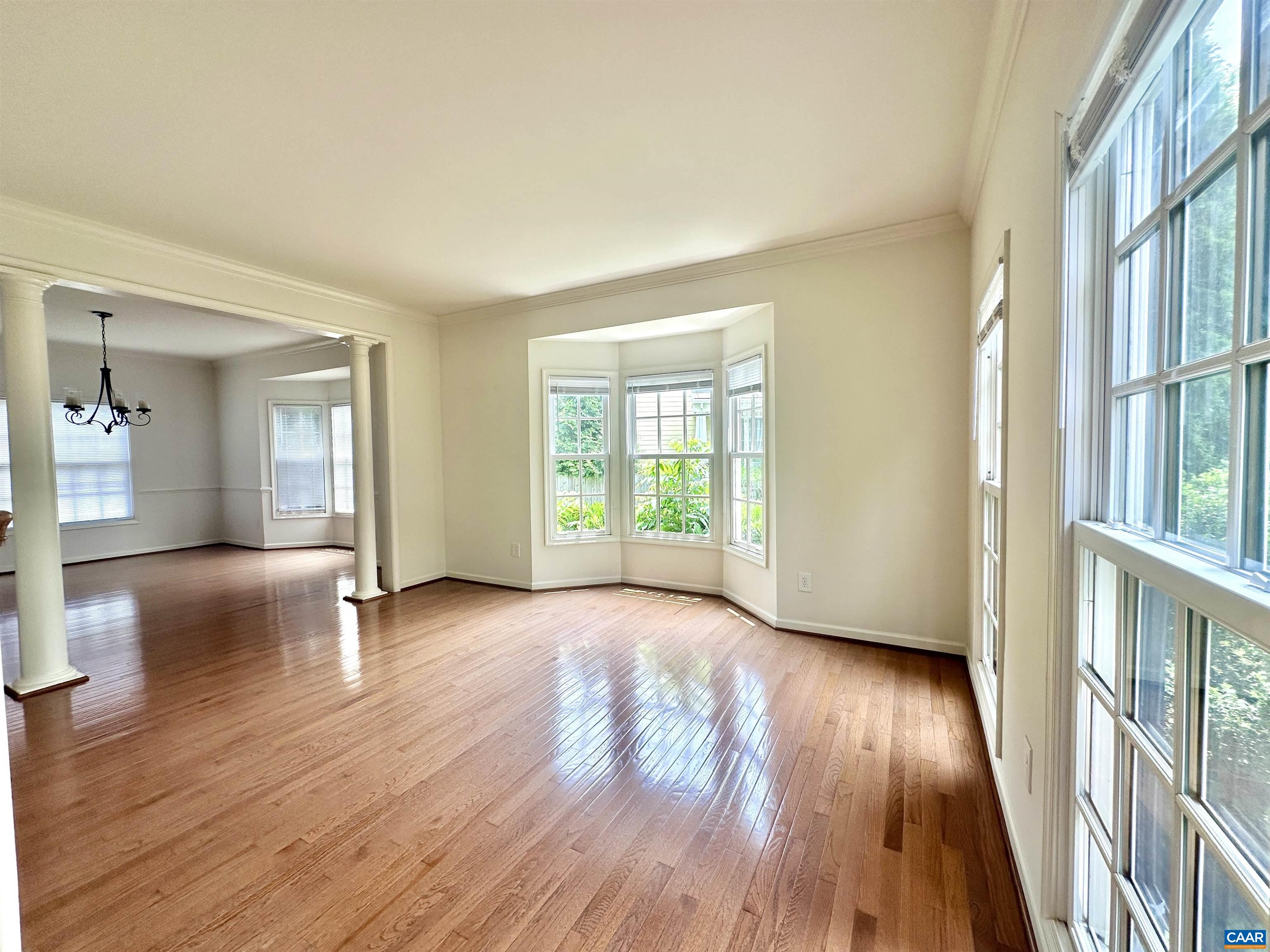 252 Millstream Drive Crozet, VA 22932 - Photo 4 of 41 a view of an empty room with wooden floor and a window