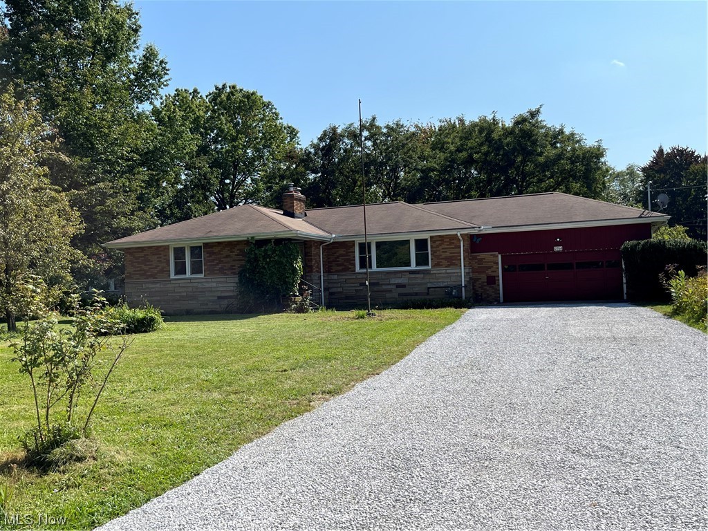 12764 Huntoon Road Painesville, OH 44077 - Photo 1 of 35 Ranch-style house with garage and a front yard