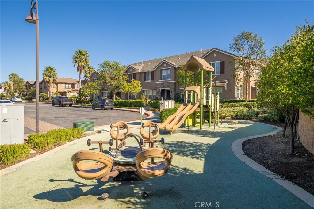 16001 Chase Road, Unit 72 Fontana, CA 92336 - Photo 24 of 43 a view of a house with swimming pool