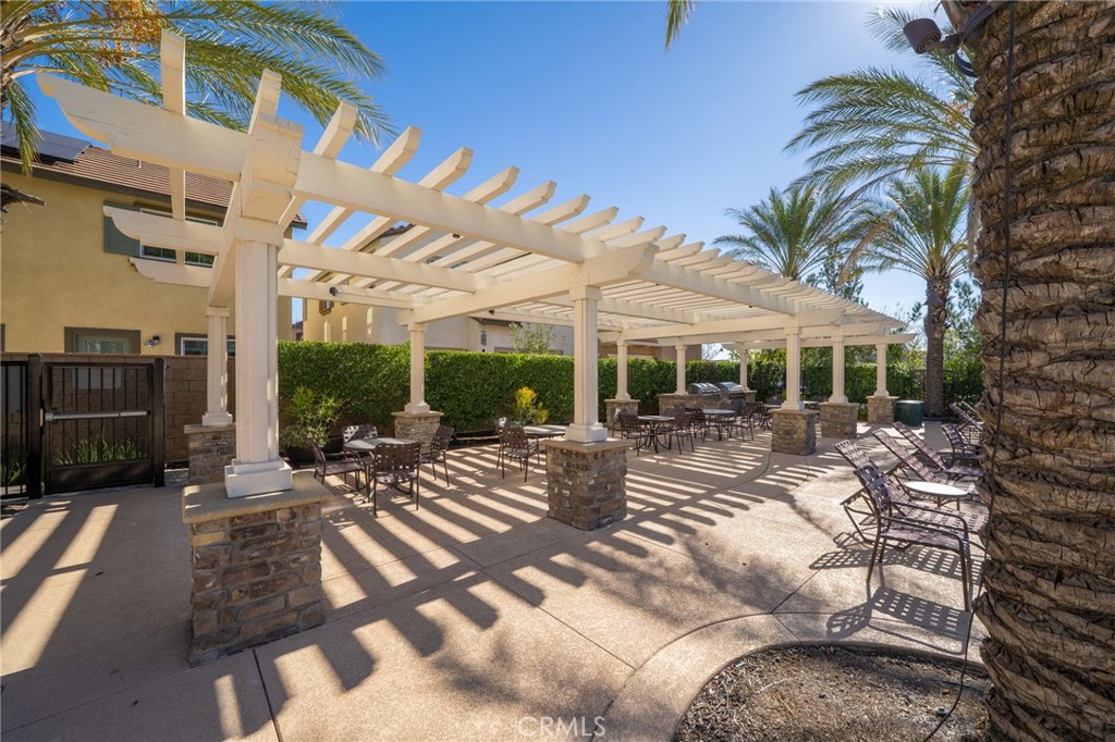16001 Chase Road, Unit 72 Fontana, CA 92336 - Photo 26 of 43 a view of swimming pool with outdoor seating and a patio