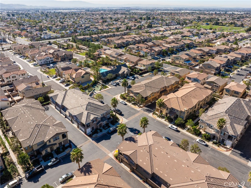 16001 Chase Road, Unit 72 Fontana, CA 92336 - Photo 34 of 43 an aerial view of a city with lots of residential buildings