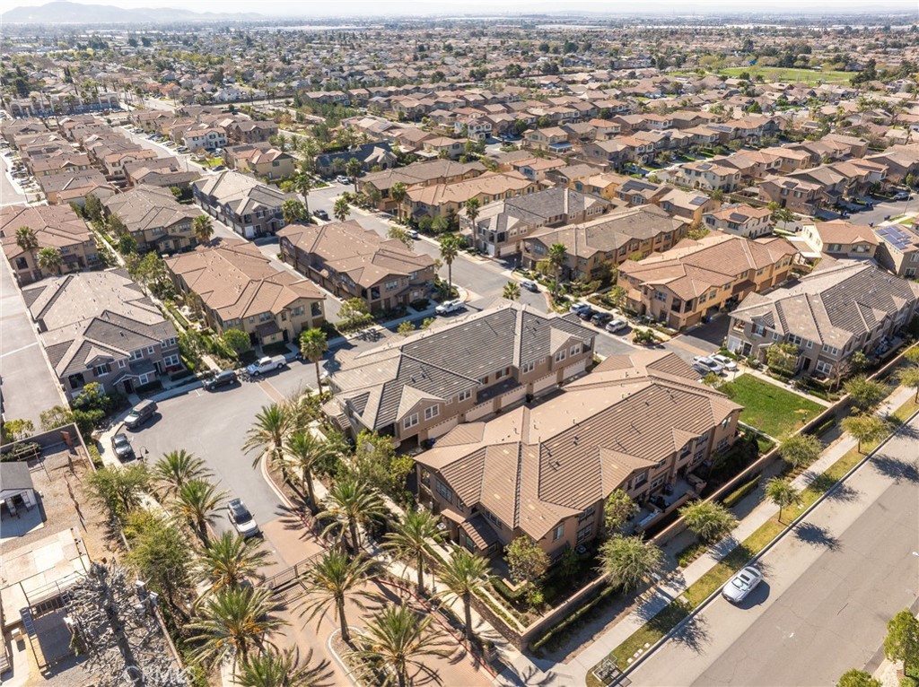 16001 Chase Road, Unit 72 Fontana, CA 92336 - Photo 42 of 43 an aerial view of residential houses with outdoor space