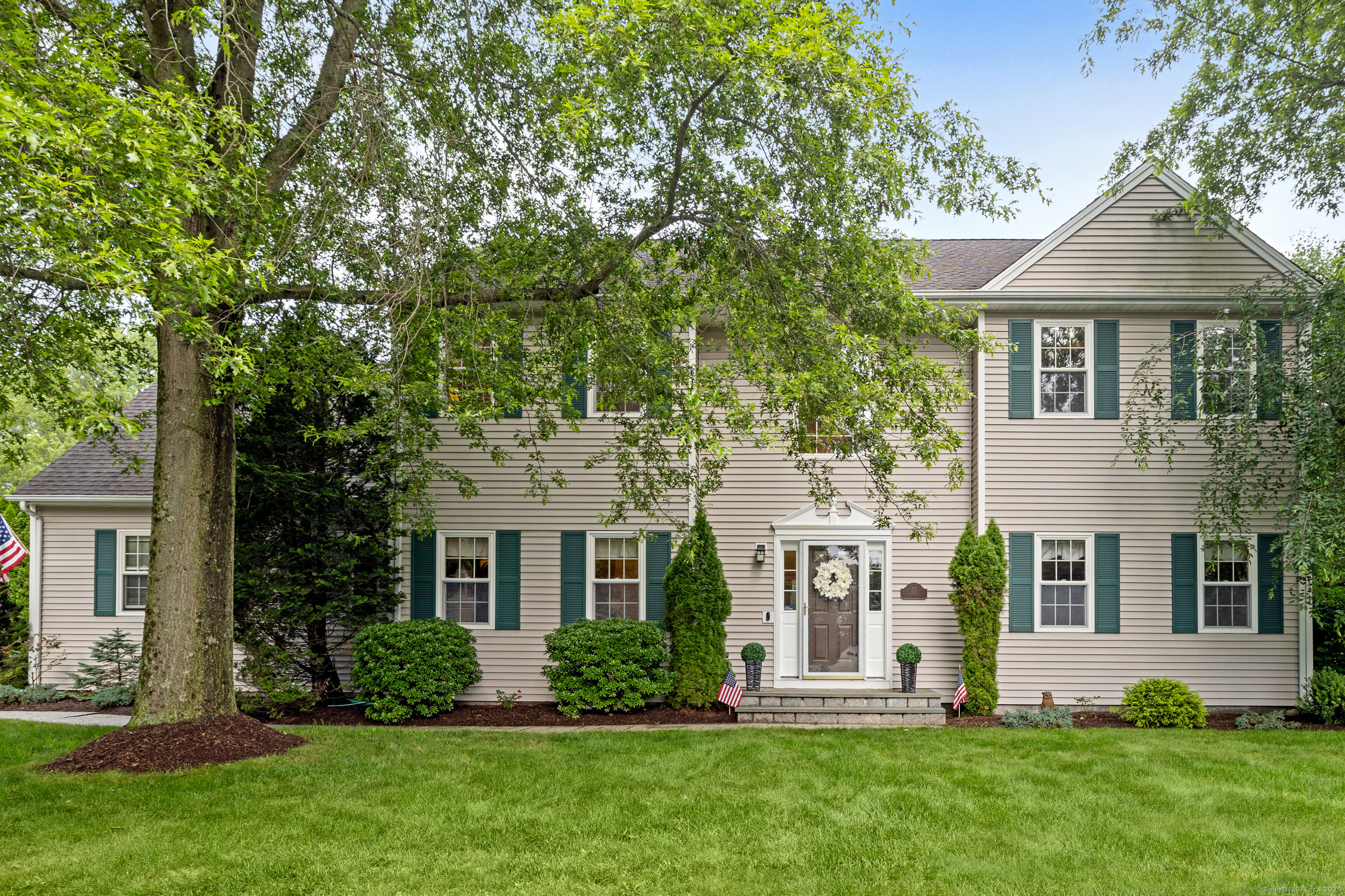 55 Secret Hollow Road, Unit 55 Monroe, CT 06468 - Photo 1 of 1 front view of a house with a yard