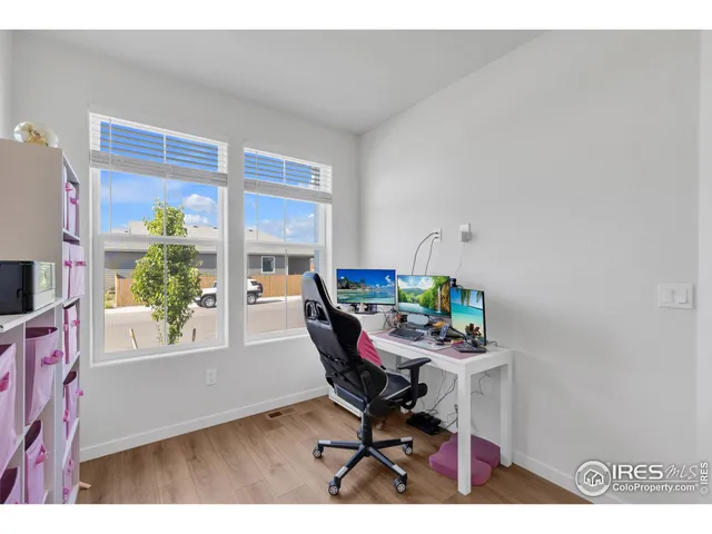 a workspace with furniture and a window
