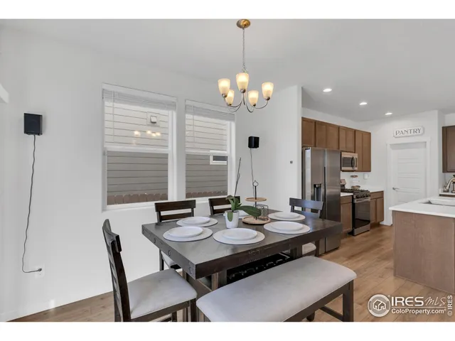 a view of a dining room that has a table and chairs